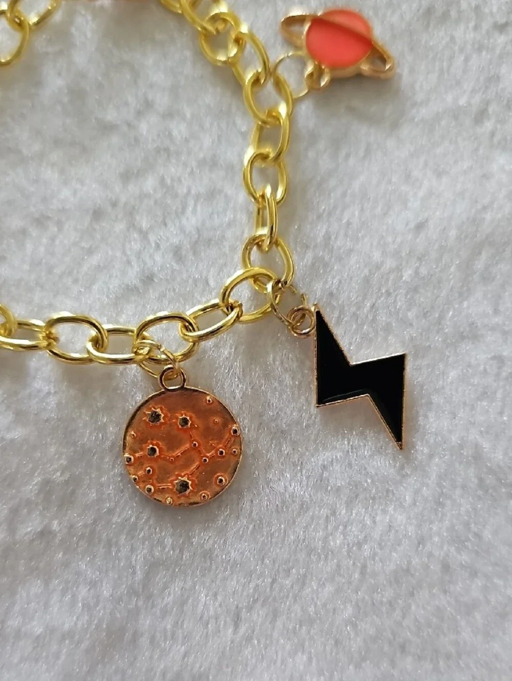 Gold Space Themed Charm Bracelet with Orange and Black Accents